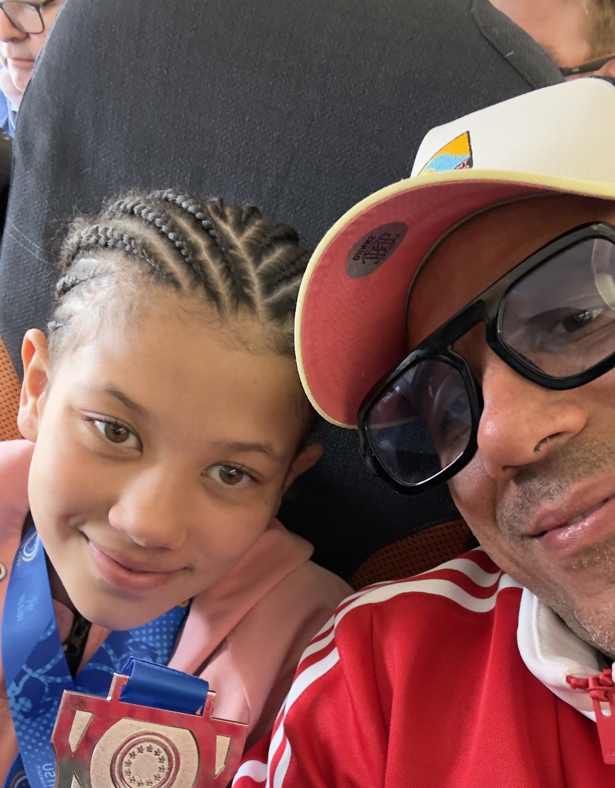 With her father after the European Kids IBJJF Championship 2026, silver medal in hand.